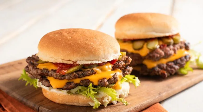 Double smash burger with melted cheese and pickles