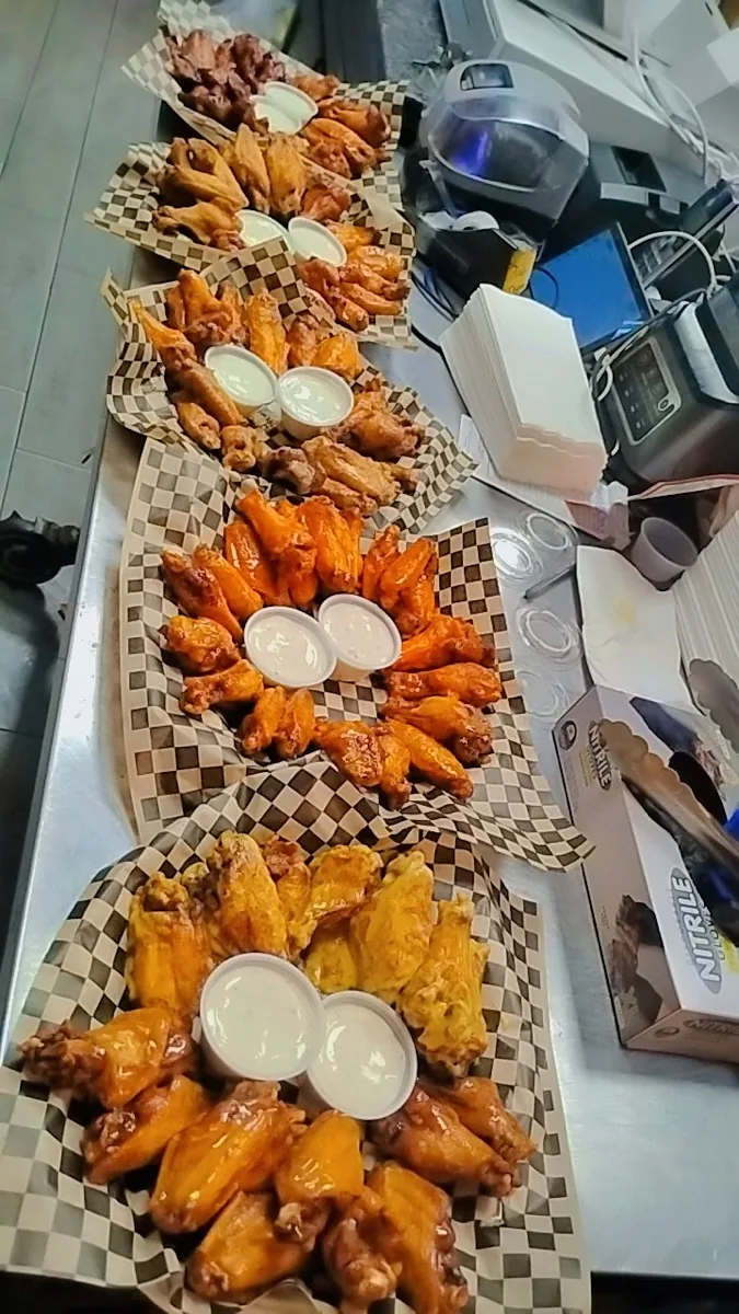 Fresh wings being boxed up in the IST NOLA kitchen